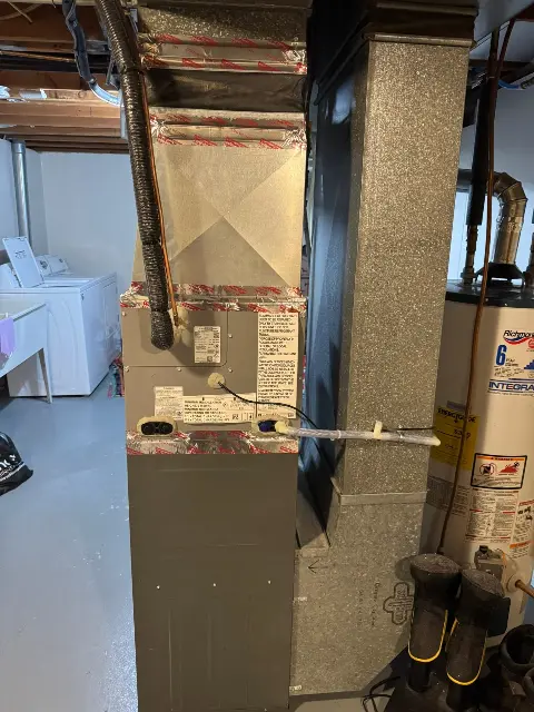 Furnace installation in a basement with ductwork in Maple Grove