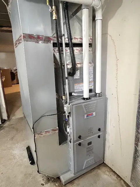 Furnace installation in a basement with ductwork in Maple Grove