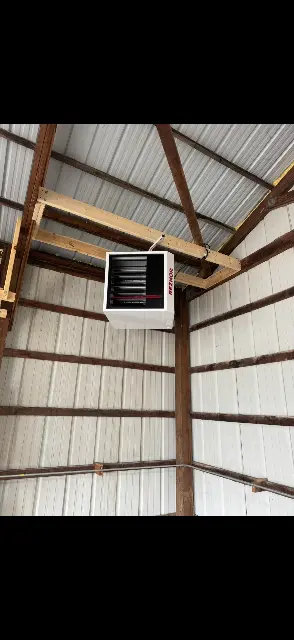 Mini-split air conditioning unit mounted on exterior wall in Maple Grove