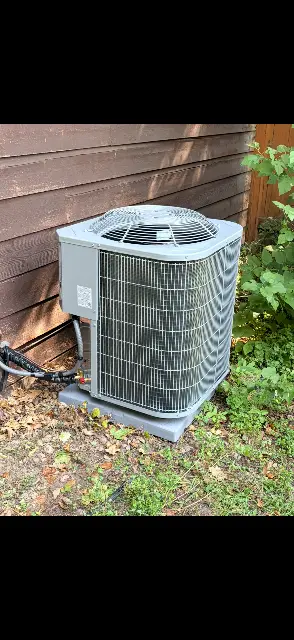 Air conditioning unit surrounded by landscaping in Maple Grove, MN