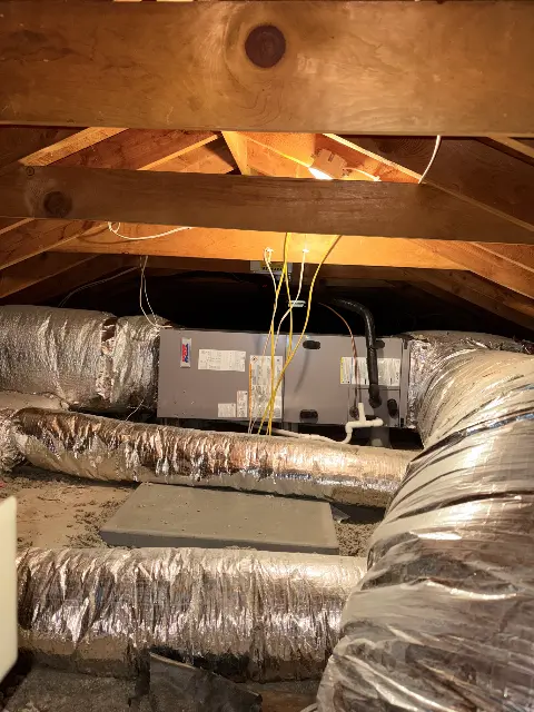 HVAC system with ductwork in a basement setting in Maple Grove