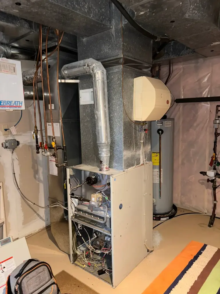 Furnace and ductwork in a basement mechanical room