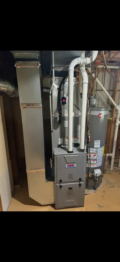 HVAC system with ductwork in a basement setting in Maple Grove